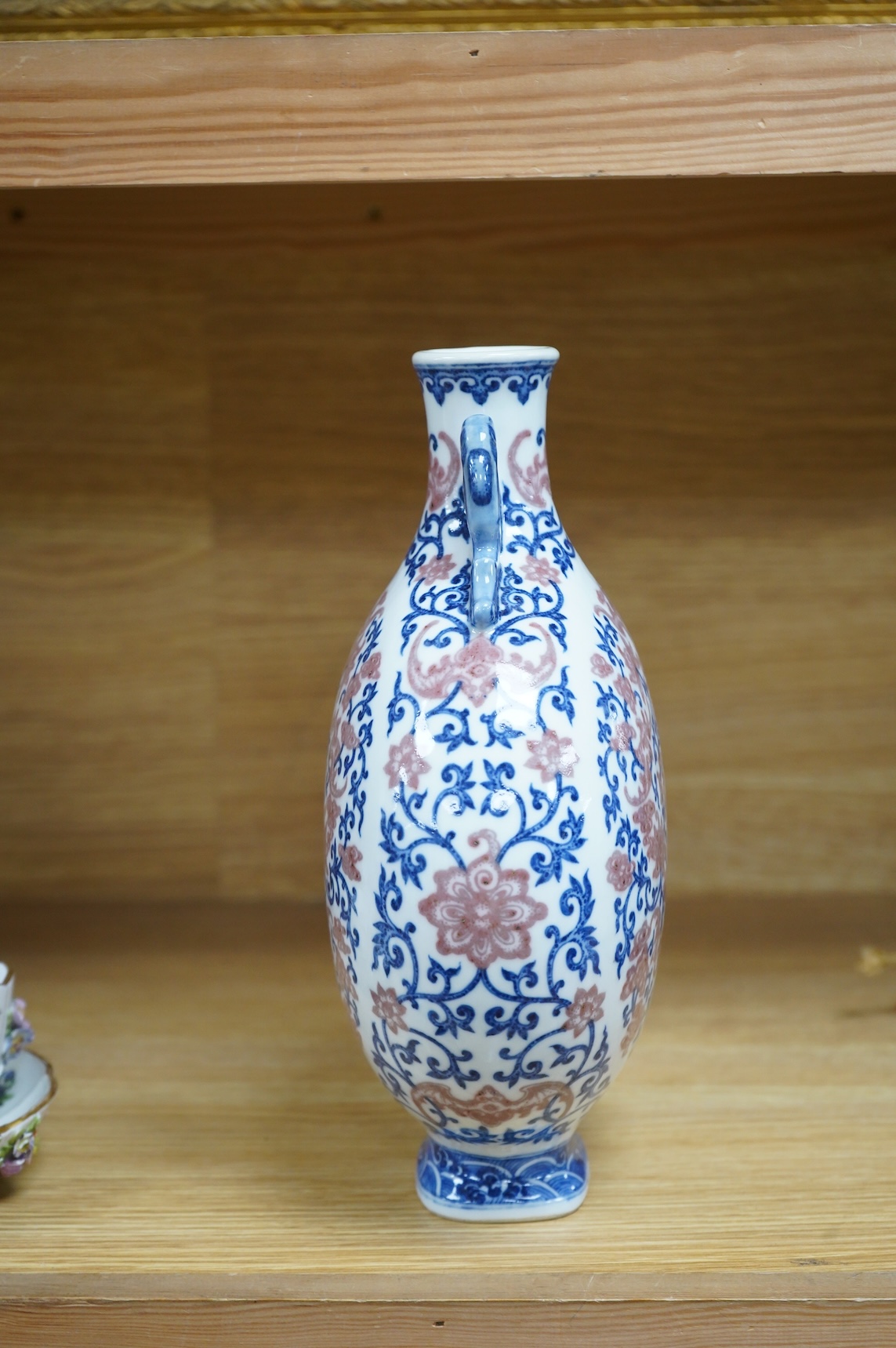 A 20th century Chinese underglaze blue and copper red moonflask, seal mark to base, 26.5cm